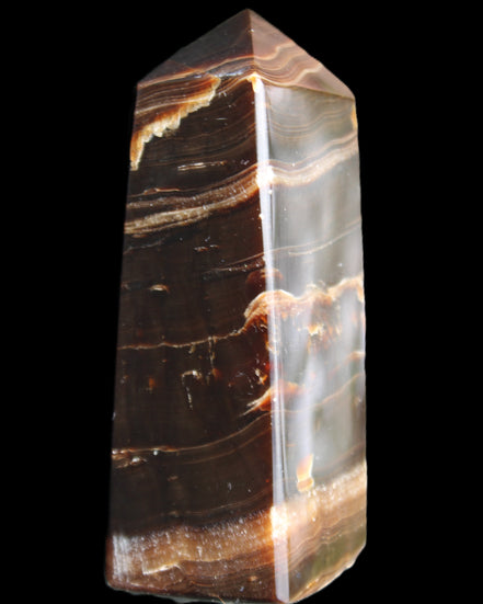 Chocolate Calcite obelisk 94*32*31mm 218g in sunlight - Rocks and Things Store
