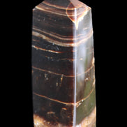 Chocolate Calcite obelisk 94*32*31mm 218g in sunlight - Rocks and Things Store