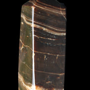 Chocolate Calcite obelisk 94*32*31mm 218g in sunlight - Rocks and Things Store