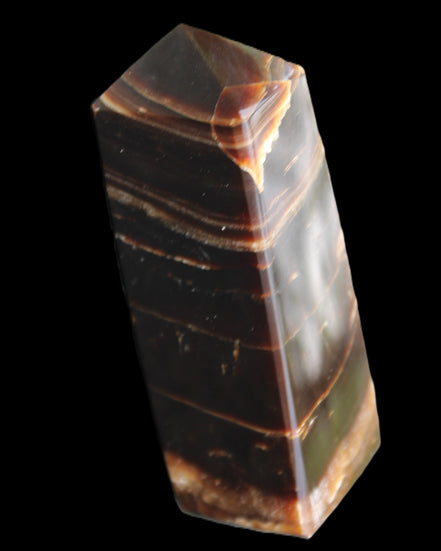 Chocolate Calcite obelisk 94*32*31mm 218g in sunlight - Rocks and Things Store