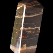Chocolate Calcite obelisk 94*32*31mm 218g in sunlight - Rocks and Things Store