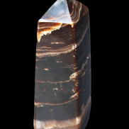 Chocolate Calcite obelisk 94*32*31mm 218g in sunlight - Rocks and Things Store