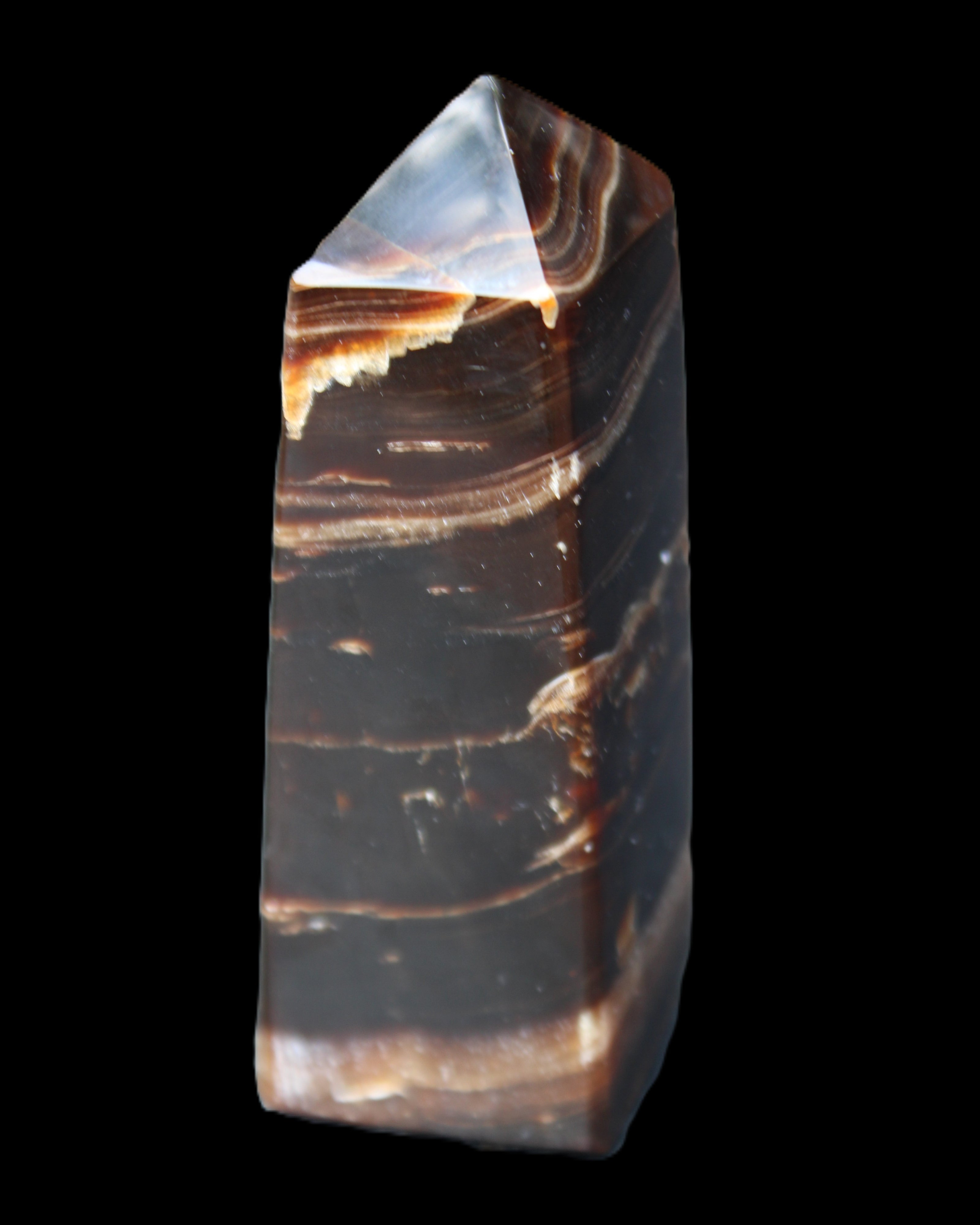 Chocolate Calcite obelisk 94*32*31mm 218g in sunlight - Rocks and Things Store
