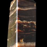 Chocolate Calcite obelisk 94*32*31mm 218g in sunlight - Rocks and Things Store