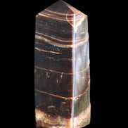 Chocolate Calcite obelisk 94*32*31mm 218g in sunlight - Rocks and Things Store
