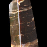 Chocolate Calcite obelisk 94*32*31mm 218g in sunlight - Rocks and Things Store