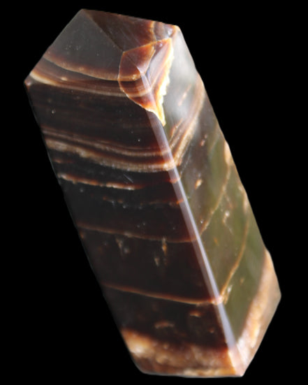 Chocolate Calcite obelisk 94*32*31mm 218g in sunlight - Rocks and Things Store