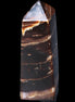 Chocolate Calcite obelisk 94*32*31mm 218g in sunlight - Rocks and Things Store