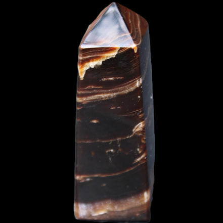 Chocolate Calcite obelisk 94*32*31mm 218g in sunlight - Rocks and Things Store