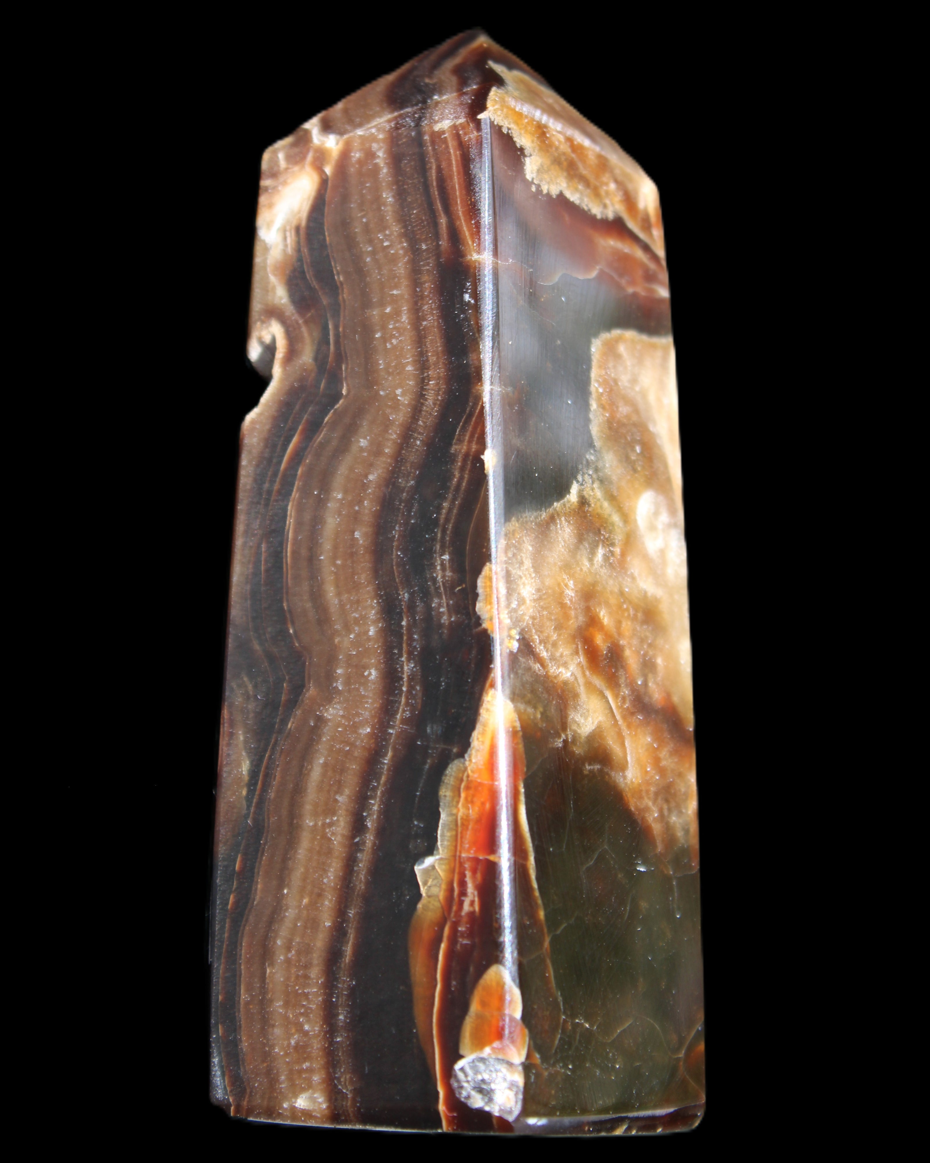 Chocolate Calcite obelisk 95*31*31mm 203g in sunlight - Rocks and Things Store