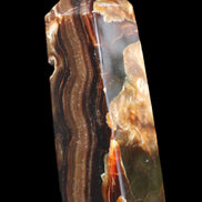 Chocolate Calcite obelisk 95*31*31mm 203g in sunlight - Rocks and Things Store