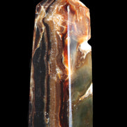 Chocolate Calcite obelisk 95*31*31mm 203g in sunlight - Rocks and Things Store