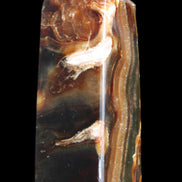 Chocolate Calcite obelisk 95*31*31mm 203g in sunlight - Rocks and Things Store