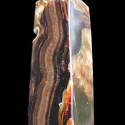 Chocolate Calcite obelisk 95*31*31mm 203g in sunlight - Rocks and Things Store