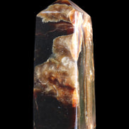 Chocolate Calcite obelisk 95*31*31mm 203g in sunlight - Rocks and Things Store