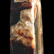 Chocolate Calcite obelisk 95*31*31mm 203g in sunlight - Rocks and Things Store