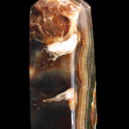 Chocolate Calcite obelisk 95*31*31mm 203g in sunlight - Rocks and Things Store