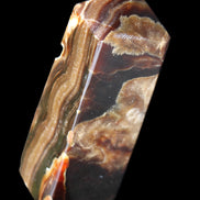 Chocolate Calcite obelisk 95*31*31mm 203g in sunlight - Rocks and Things Store