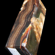 Chocolate Calcite obelisk 95*31*31mm 203g in sunlight - Rocks and Things Store