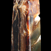 Chocolate Calcite obelisk 95*31*31mm 203g in sunlight - Rocks and Things Store
