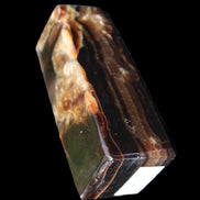 Chocolate Calcite obelisk 95*31*31mm 203g in sunlight - Rocks and Things Store