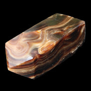 Chocolate Calcite obelisk 84*33*28mm 175g in sunlight - Rocks and Things Store