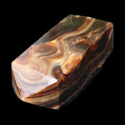 Chocolate Calcite obelisk 84*33*28mm 175g in sunlight - Rocks and Things Store