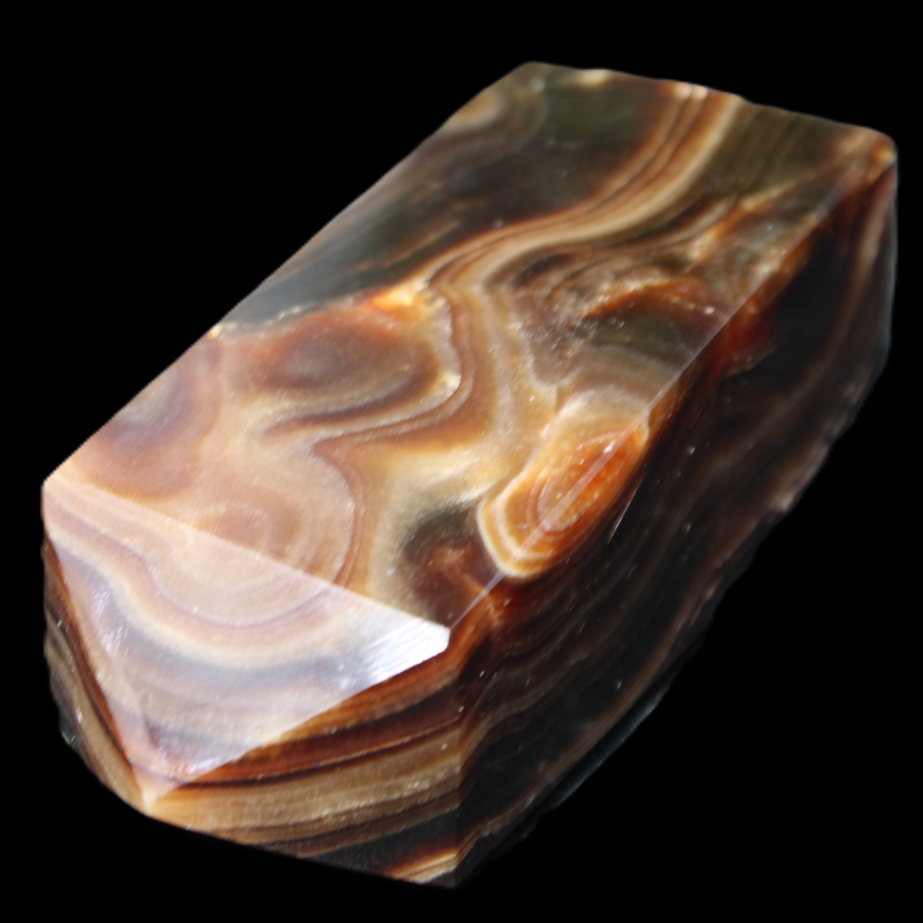 Chocolate Calcite obelisk 84*33*28mm 175g in sunlight - Rocks and Things Store