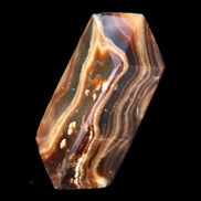 Chocolate Calcite obelisk 84*33*28mm 175g in sunlight - Rocks and Things Store