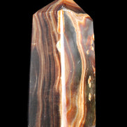 Chocolate Calcite obelisk 84*33*28mm 175g in sunlight - Rocks and Things Store