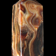 Chocolate Calcite obelisk 84*33*28mm 175g in sunlight - Rocks and Things Store