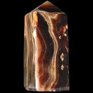 Chocolate Calcite obelisk 84*33*28mm 175g in sunlight - Rocks and Things Store