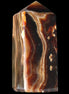 Chocolate Calcite obelisk 84*33*28mm 175g in sunlight - Rocks and Things Store