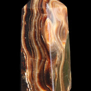 Chocolate Calcite obelisk 84*33*28mm 175g in sunlight - Rocks and Things Store