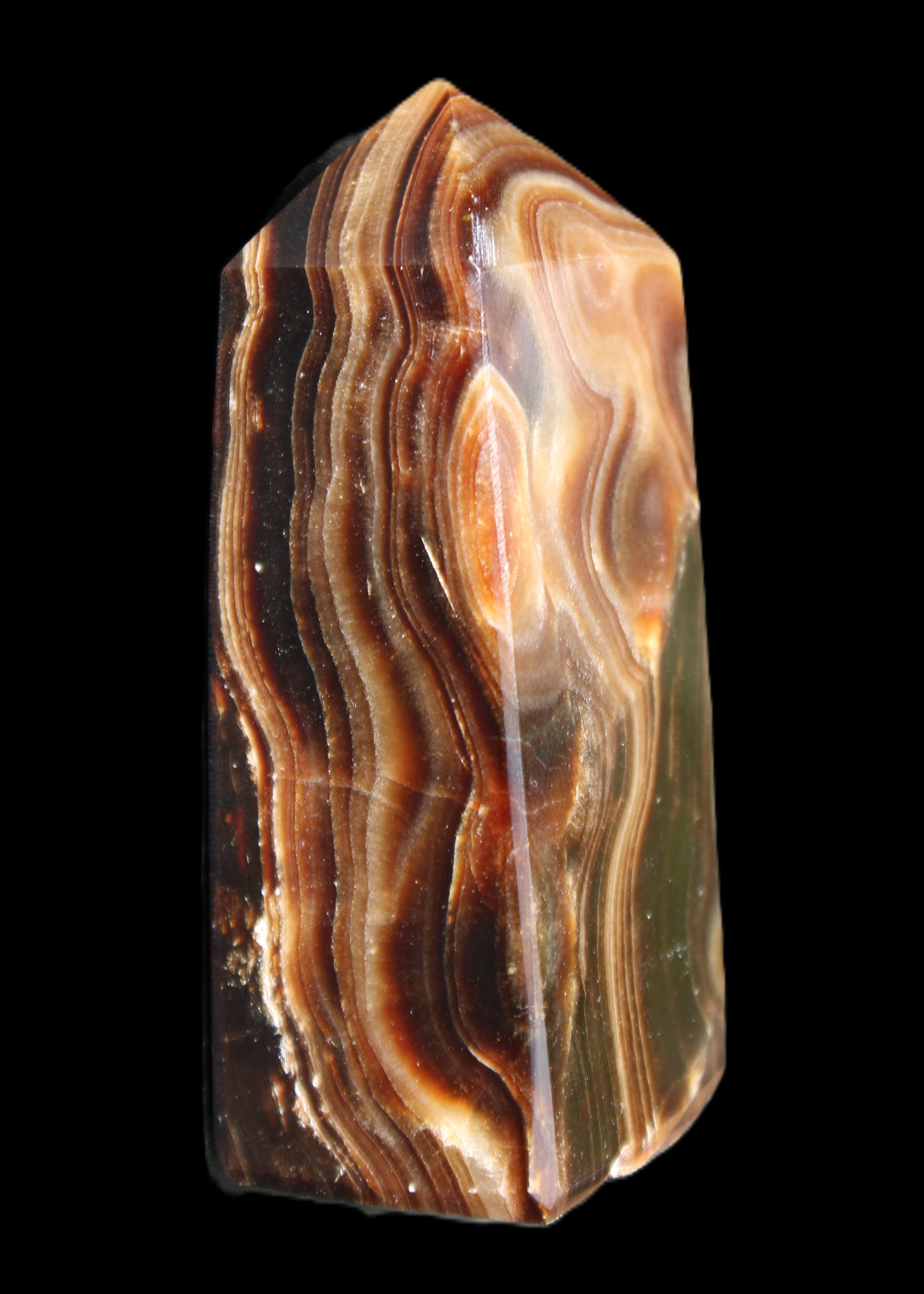 Chocolate Calcite obelisk 84*33*28mm 175g in sunlight - Rocks and Things Store