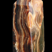 Chocolate Calcite obelisk 84*33*28mm 175g in sunlight - Rocks and Things Store