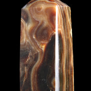 Chocolate Calcite obelisk 84*33*28mm 175g in sunlight - Rocks and Things Store