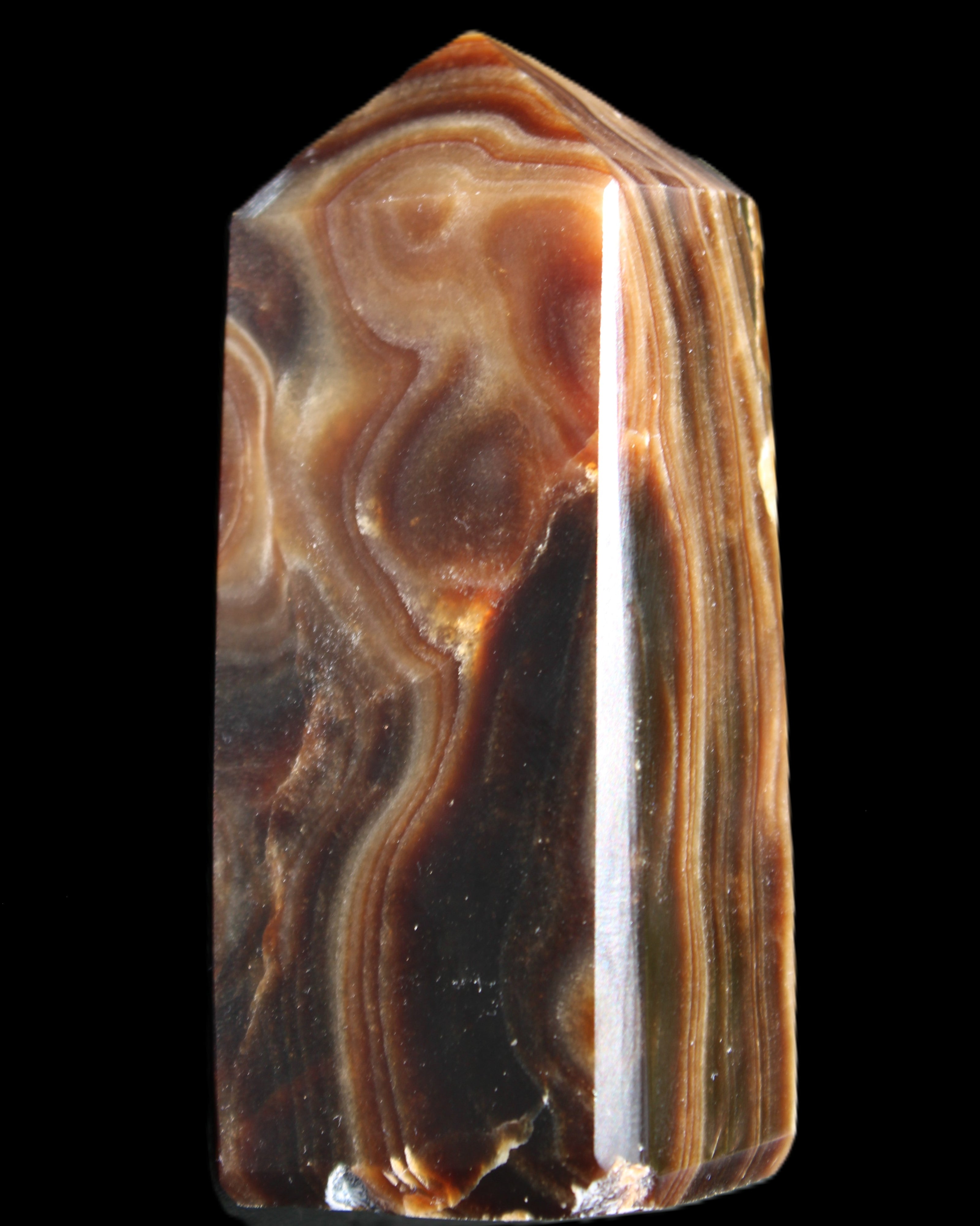Chocolate Calcite obelisk 84*33*28mm 175g in sunlight - Rocks and Things Store