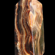 Chocolate Calcite obelisk 84*33*28mm 175g in sunlight - Rocks and Things Store
