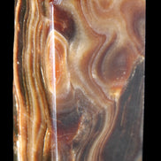 Chocolate Calcite obelisk 84*33*28mm 175g in sunlight - Rocks and Things Store