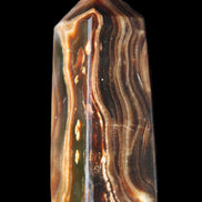 Chocolate Calcite obelisk 84*33*28mm 175g in sunlight - Rocks and Things Store
