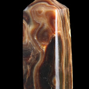 Chocolate Calcite obelisk 84*33*28mm 175g in sunlight - Rocks and Things Store