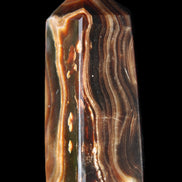 Chocolate Calcite obelisk 84*33*28mm 175g in sunlight - Rocks and Things Store