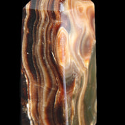 Chocolate Calcite obelisk 84*33*28mm 175g in sunlight - Rocks and Things Store