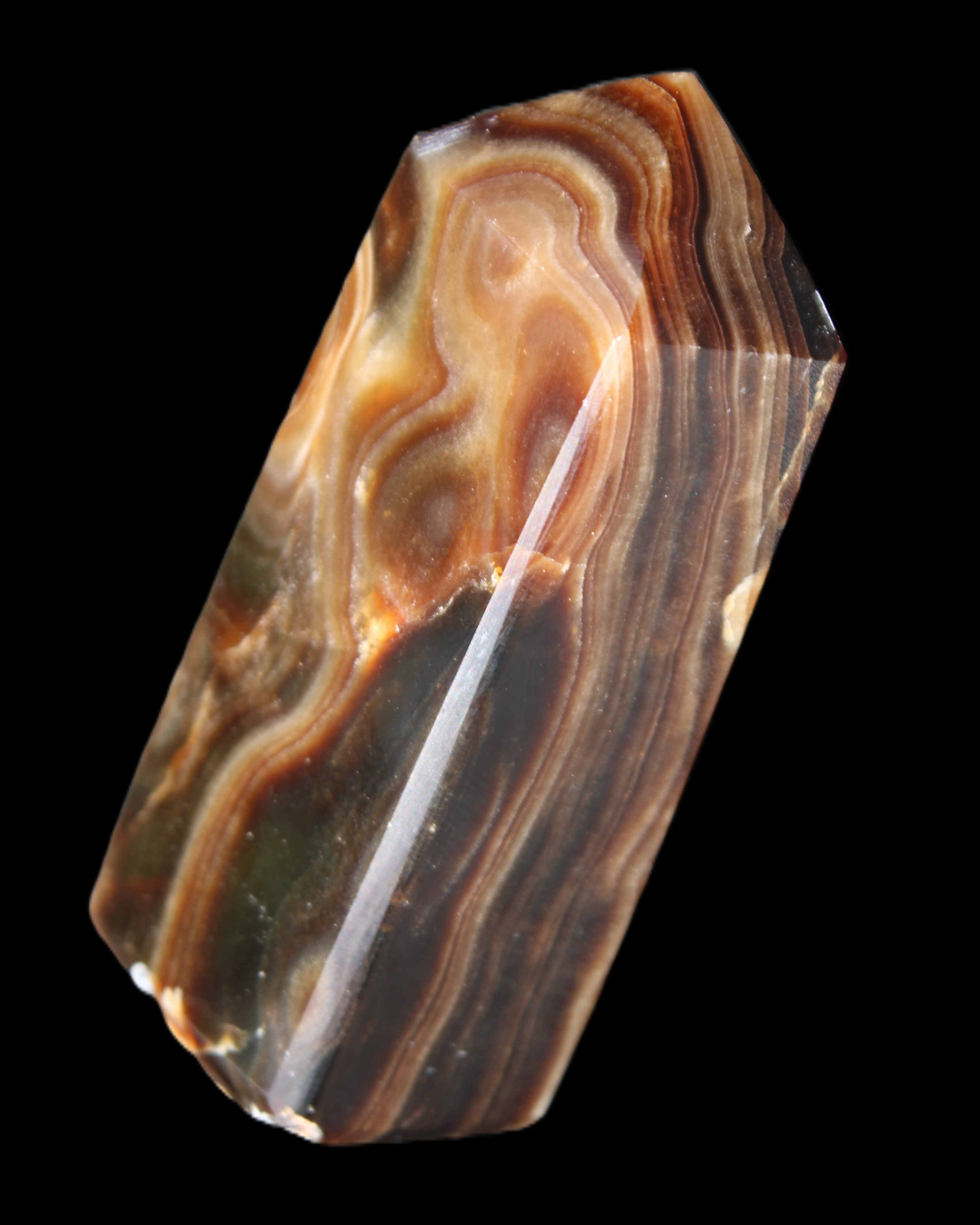 Chocolate Calcite obelisk 84*33*28mm 175g in sunlight - Rocks and Things Store
