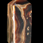 Chocolate Calcite obelisk 84*33*28mm 175g in sunlight - Rocks and Things Store