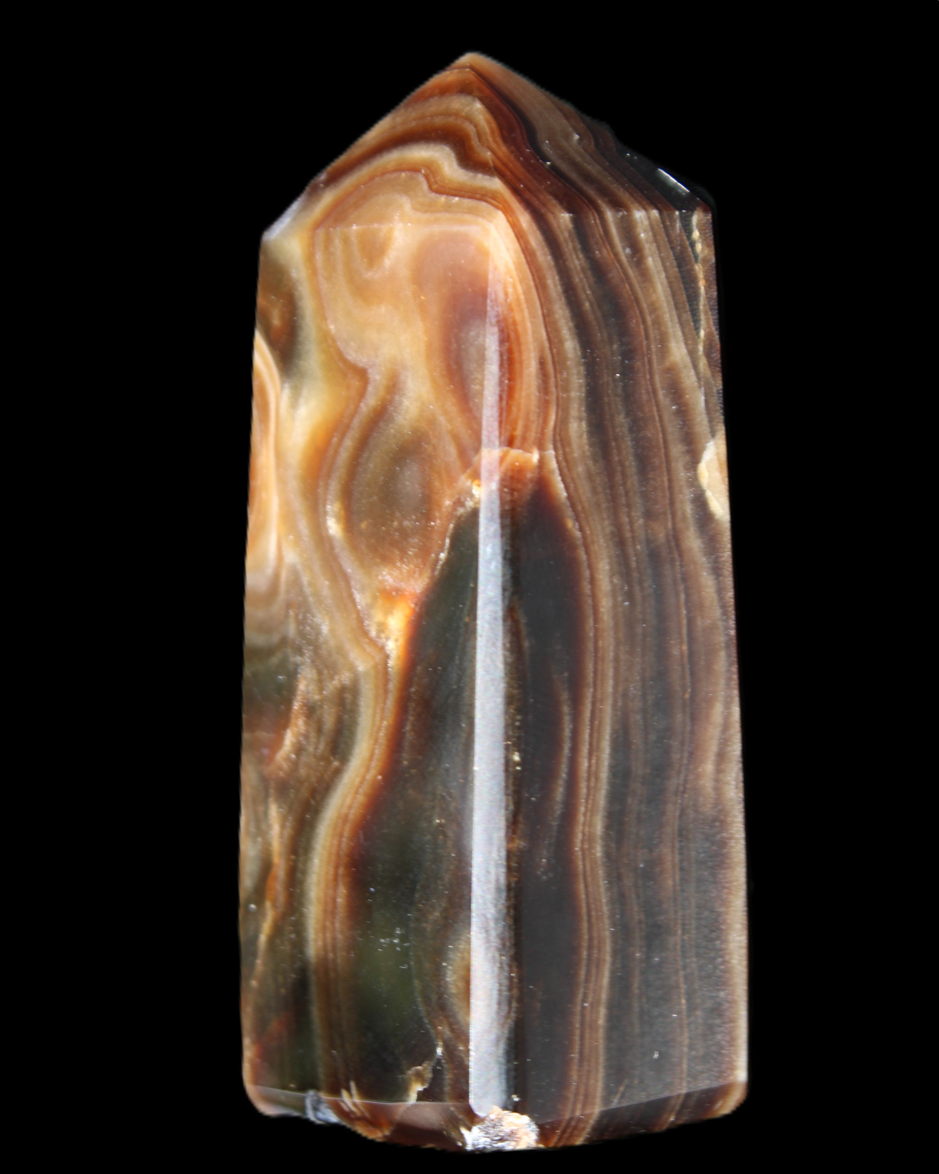 Chocolate Calcite obelisk 84*33*28mm 175g in sunlight - Rocks and Things Store