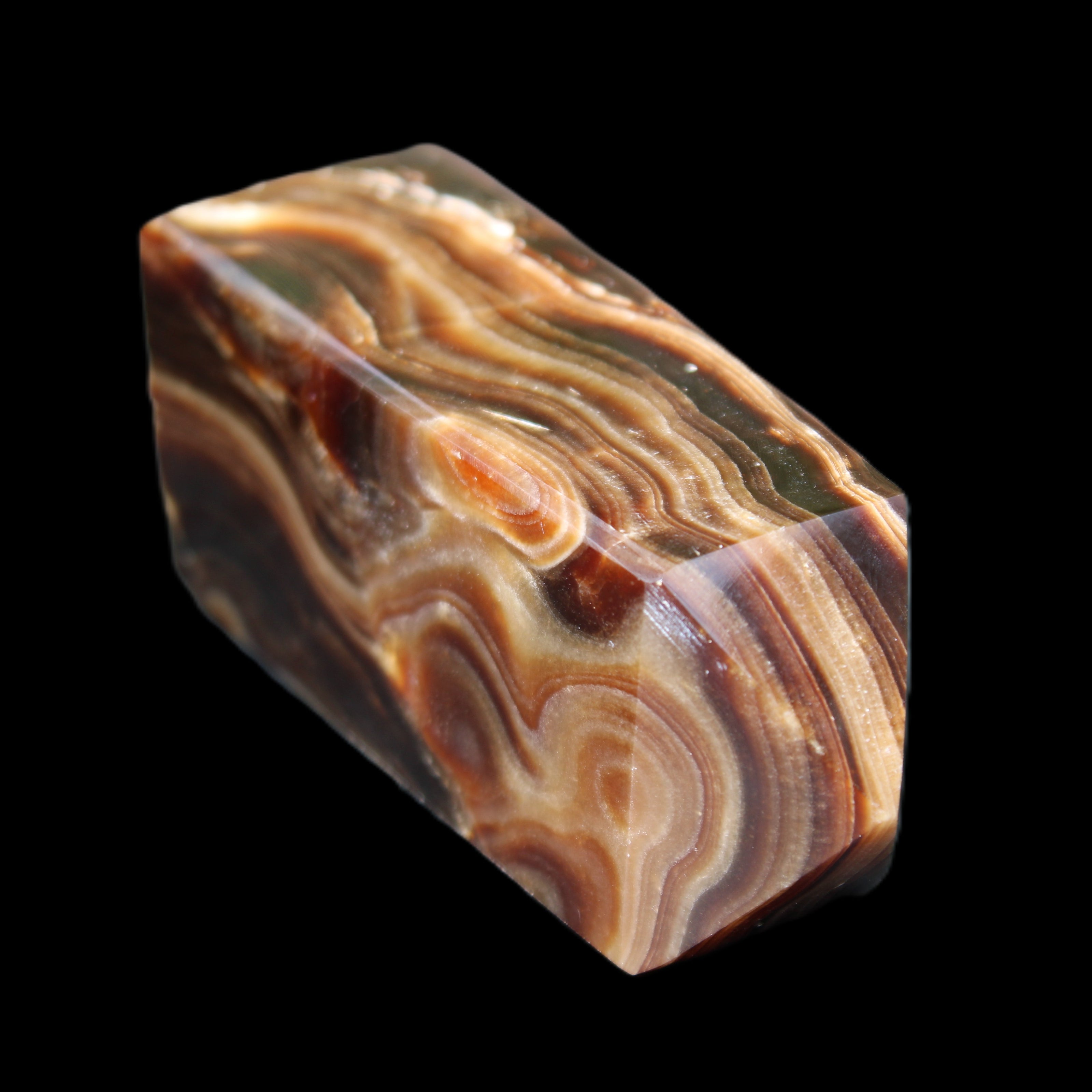 Chocolate Calcite obelisk 84*33*28mm 175g in sunlight - Rocks and Things Store