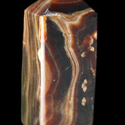 Chocolate Calcite obelisk 84*33*28mm 175g in sunlight - Rocks and Things Store
