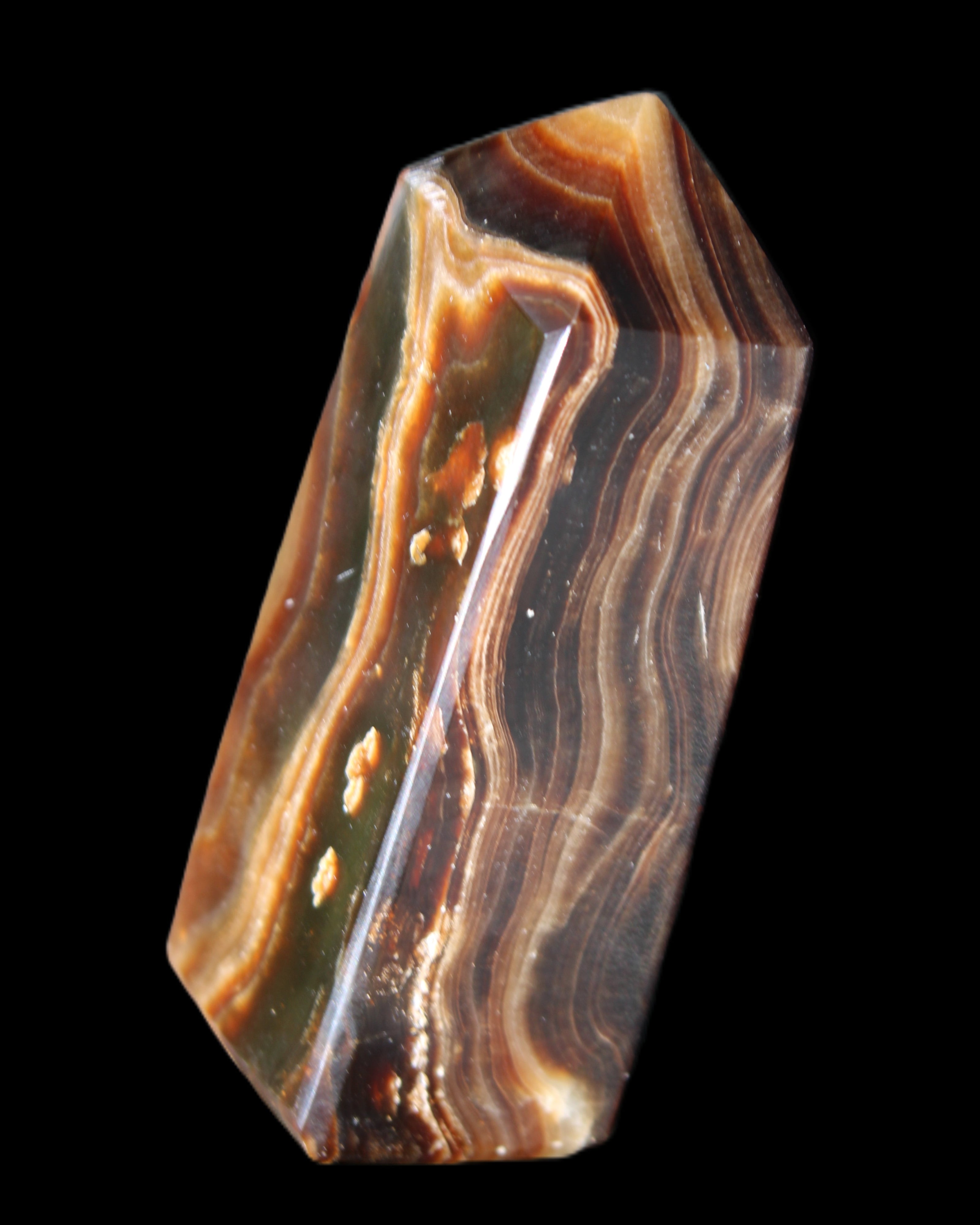 Chocolate Calcite obelisk 84*33*28mm 175g in sunlight - Rocks and Things Store